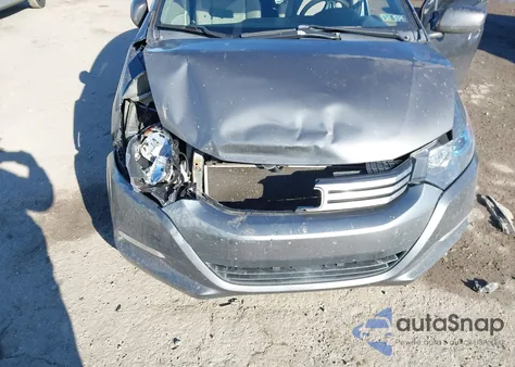 2011 Honda Insight from USA, damaged, VIN JHMZE2H31BS008200